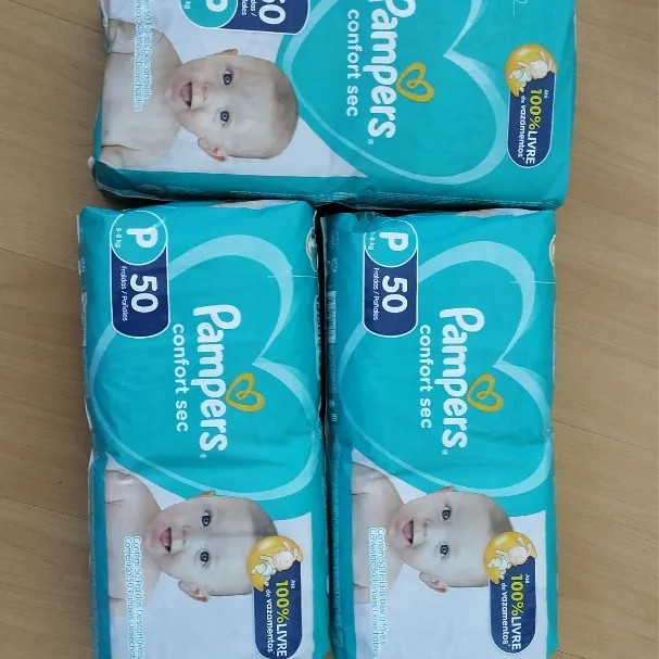 Troco 3 pacotes de fraldas P